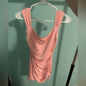 Pink mini dress with open back and a bow